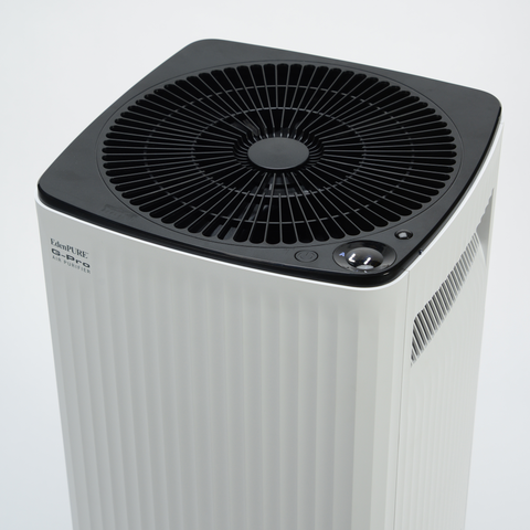 EdenPURE G-Pro Air Purifier by Airdog with white body and black top vent isolated on white background