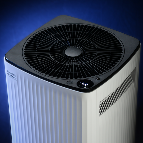 EdenPURE G-PRO Air Purifier by Airdog in white with black top and digital display illuminated on blue background