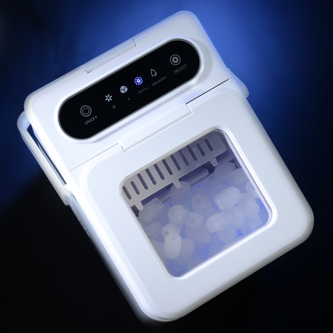 EdenPURE UV IcePRO compact ice maker in white with clear lid showing cylindrical ice cubes under blue light