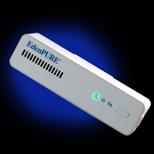 Close-up of the white EdenPURE Thunderstorm Refrigerator Air Purifier with illuminated green indicator light, ventilation openings, and one-button controls against a blue and black background.
